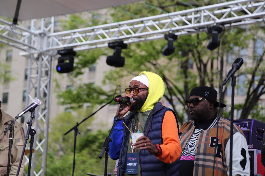 Two vocalists at the microphones on stage