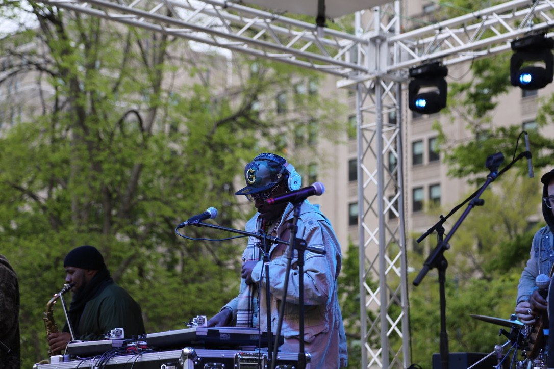 DJ and saxophonist performing on stage