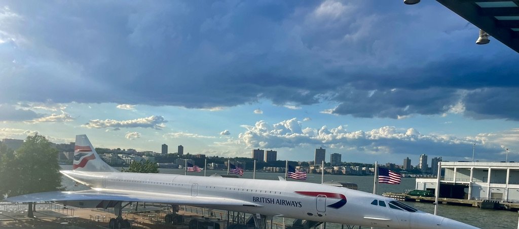 British Airways Concorde on the Intrepid Museum pier with the Hudson River behind it